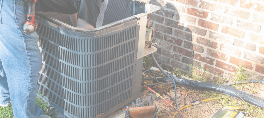 An AC Tech Installing a Replacement Air Conditioner