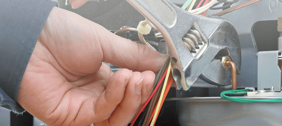 A Furnace Tech Tuning Up a Furnace