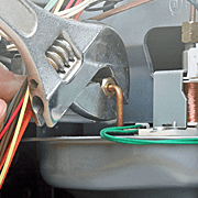 A Tech Tuning Up a Furnace